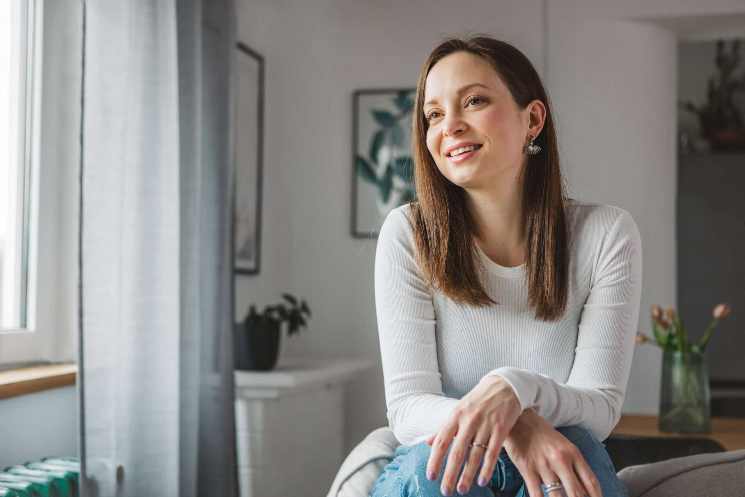 Women at peace in her living room