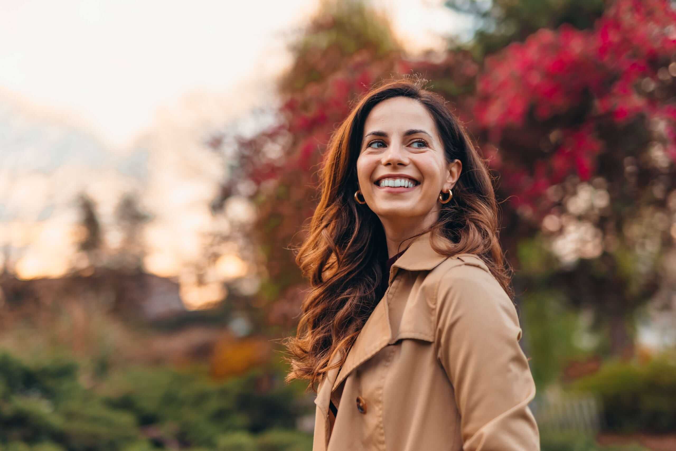 Smiling woman in a park
