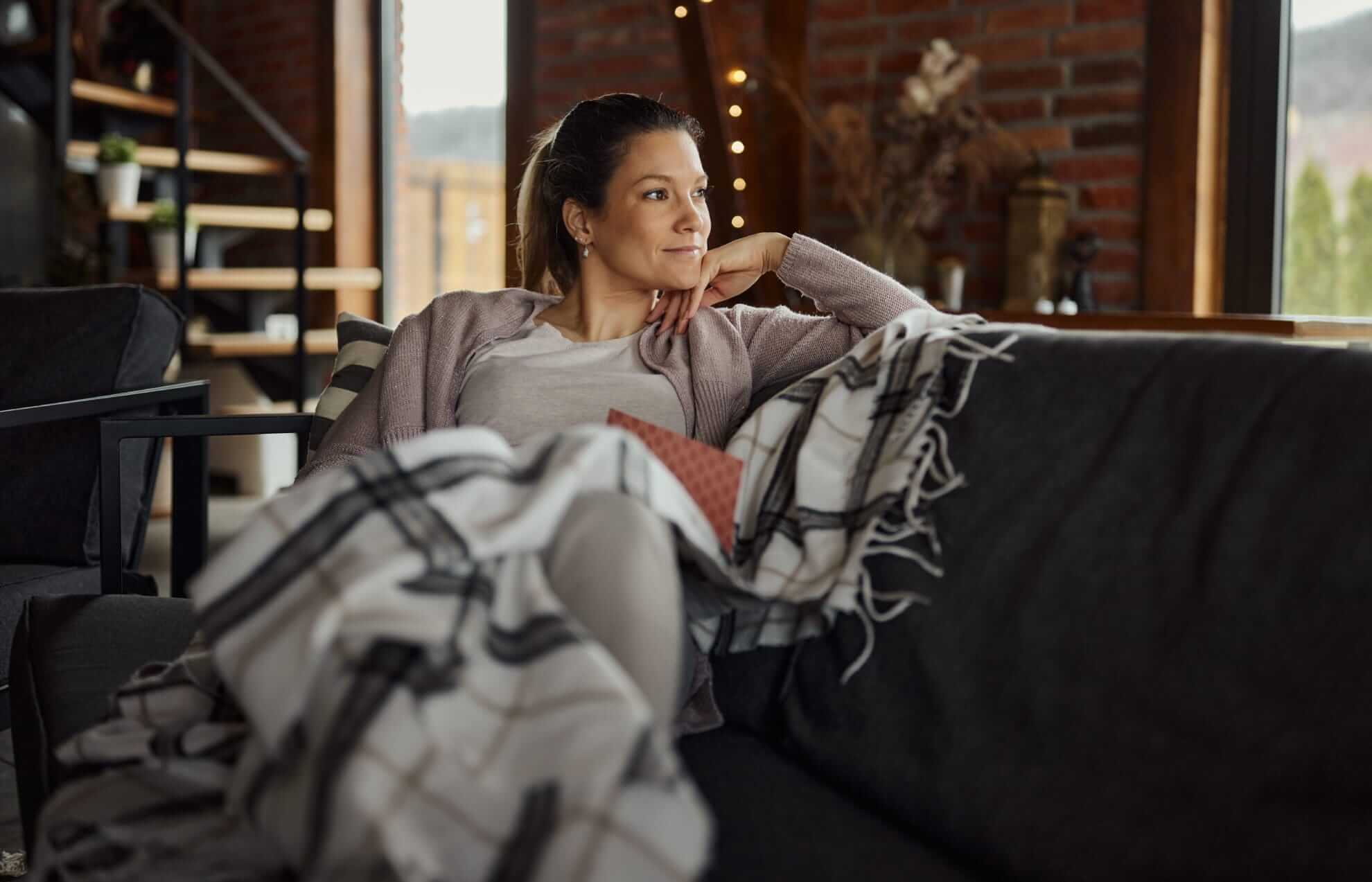 woman lounging on a sofa