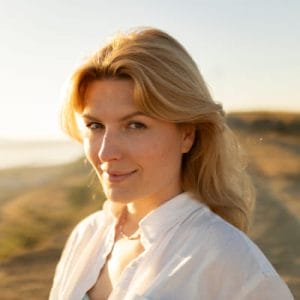 smiley blond hair lady at the beach