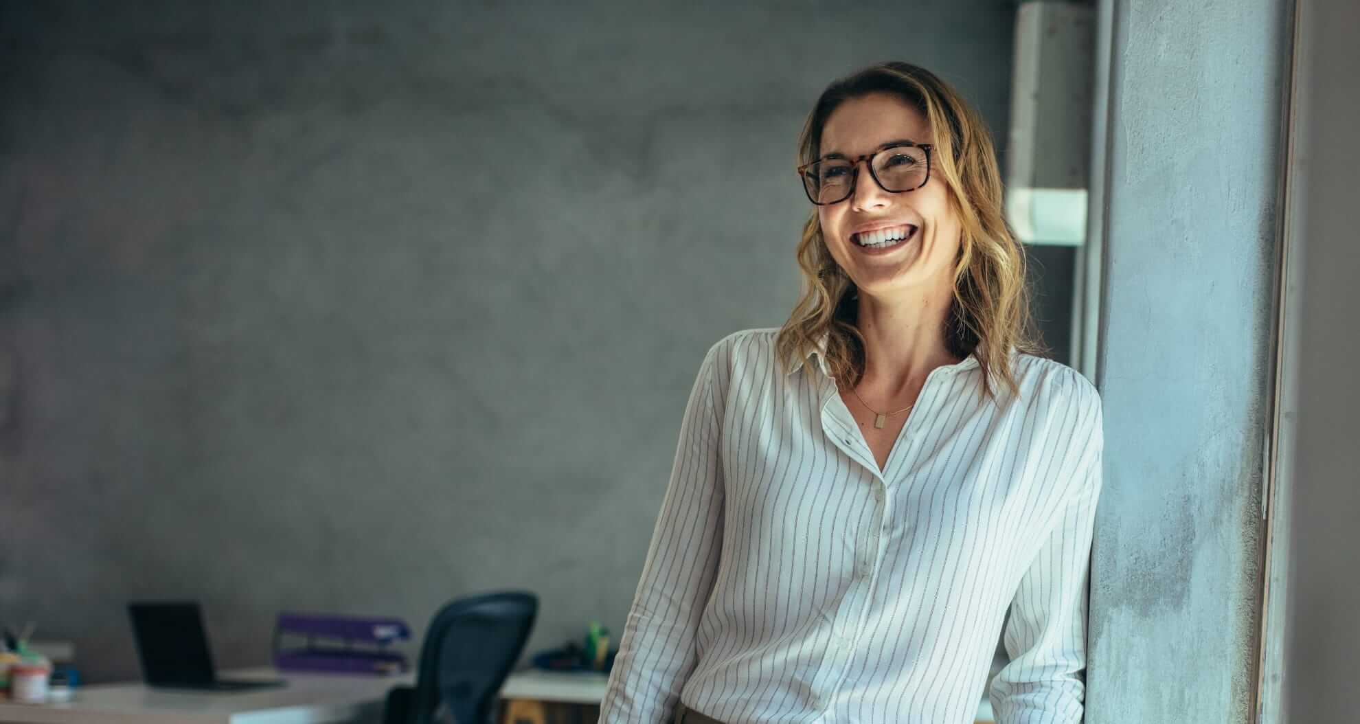 smiley lady in a white striped long-sleeve blouse