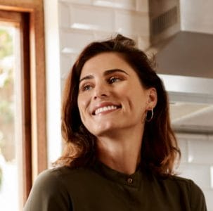 smiley woman at kitchen