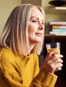 a woman enjoying a beverage