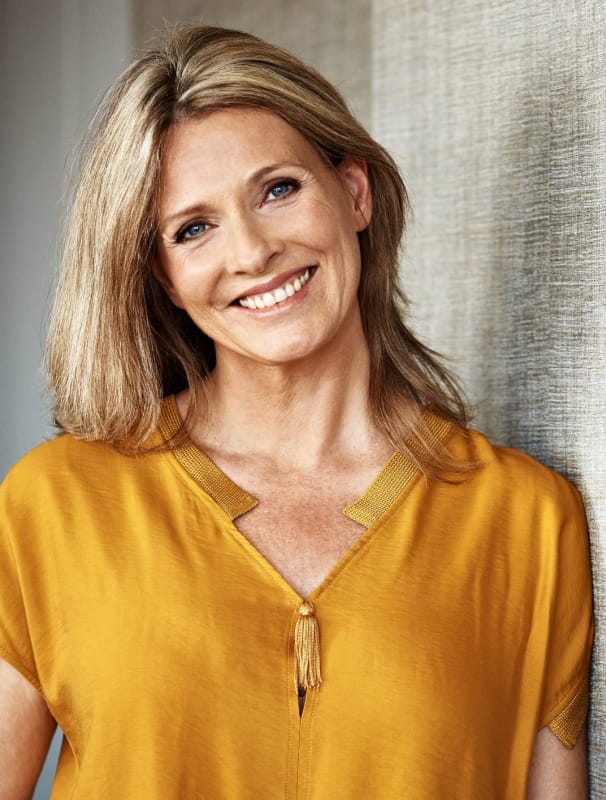 smiley woman with blue eyes