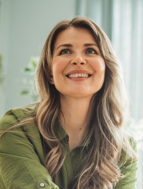 woman looking up with a gentle smile 