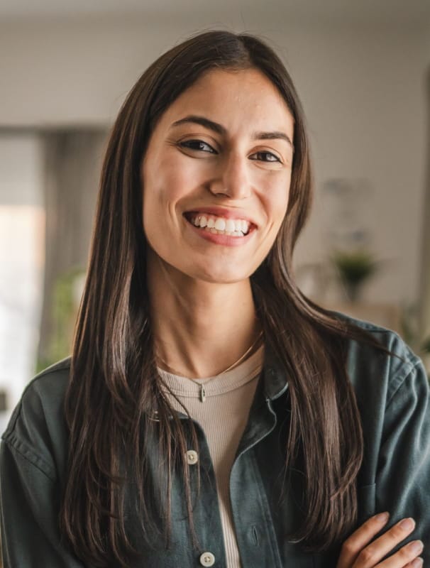 a woman smiling directly at the camera