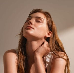a woman with glowing skin
